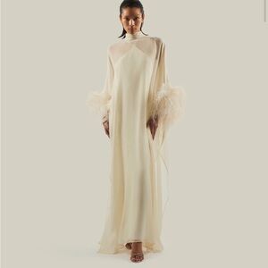 Taller Marmo Elegant Ivory Feathered Gown